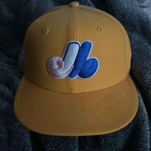 selling a size 7 1982 all star yellow and light pink montreal hat.